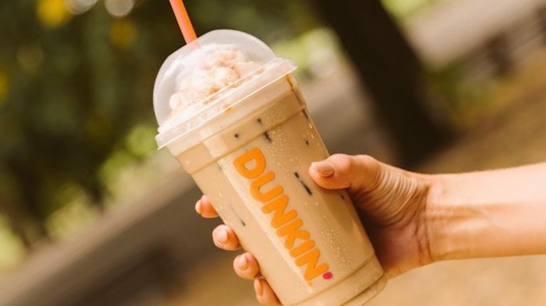 hand holding signature iced latte