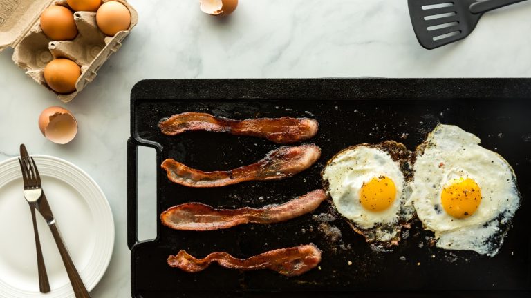 https://www.tastingtable.com/1556028/clean-burnt-bits-cast-iron-griddle/